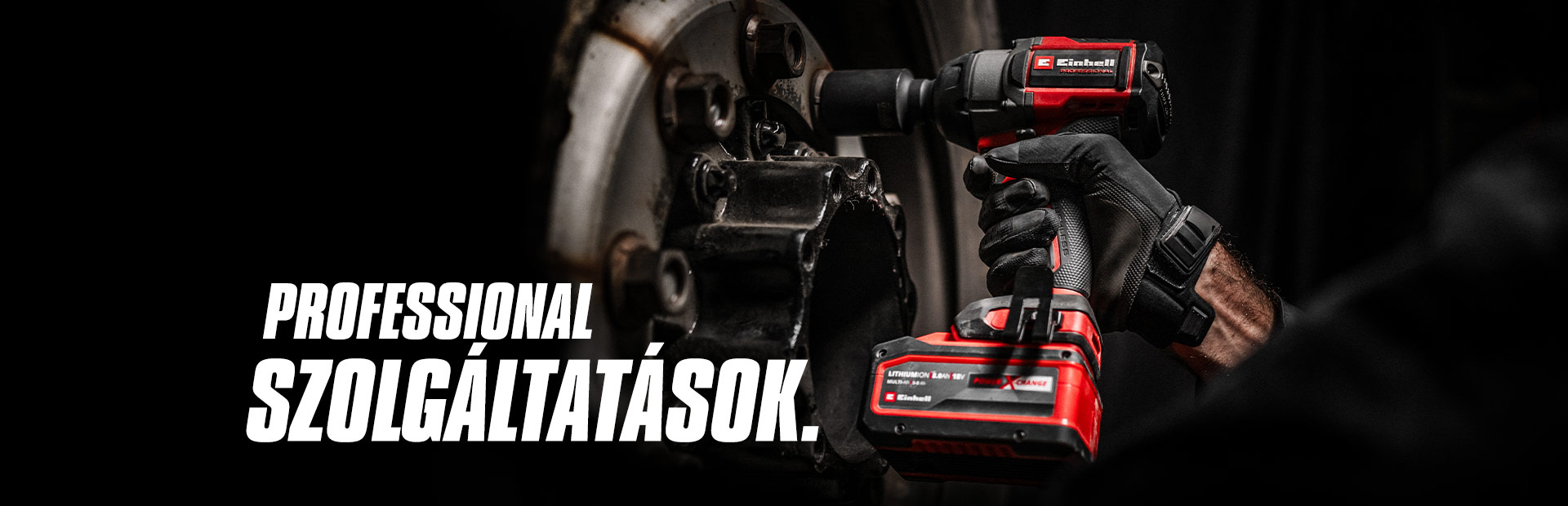 Close-up of a red cordless impact wrench being used on a wheel, with the text "Professional Services".