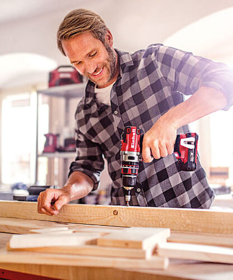 man working with a cordless screwdriver