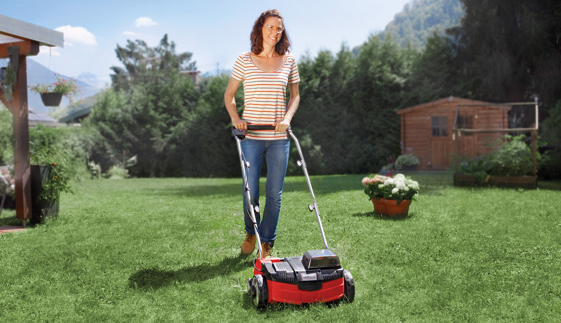 a woman scarifies her lawn