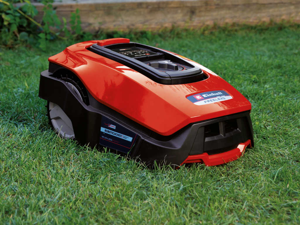 Robotic lawnmower stands in the lawn