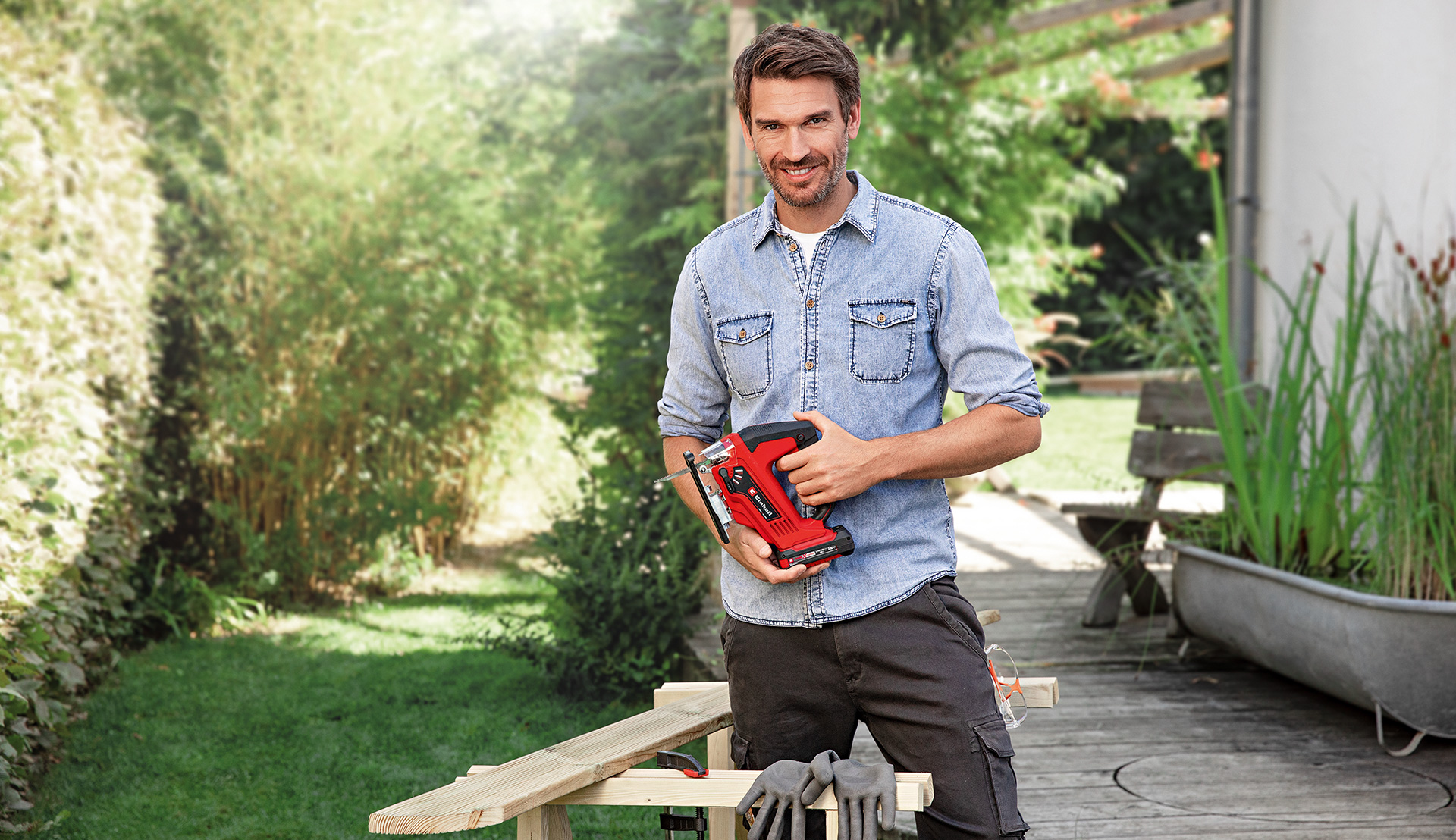 a man holds a jigsaw in his hand