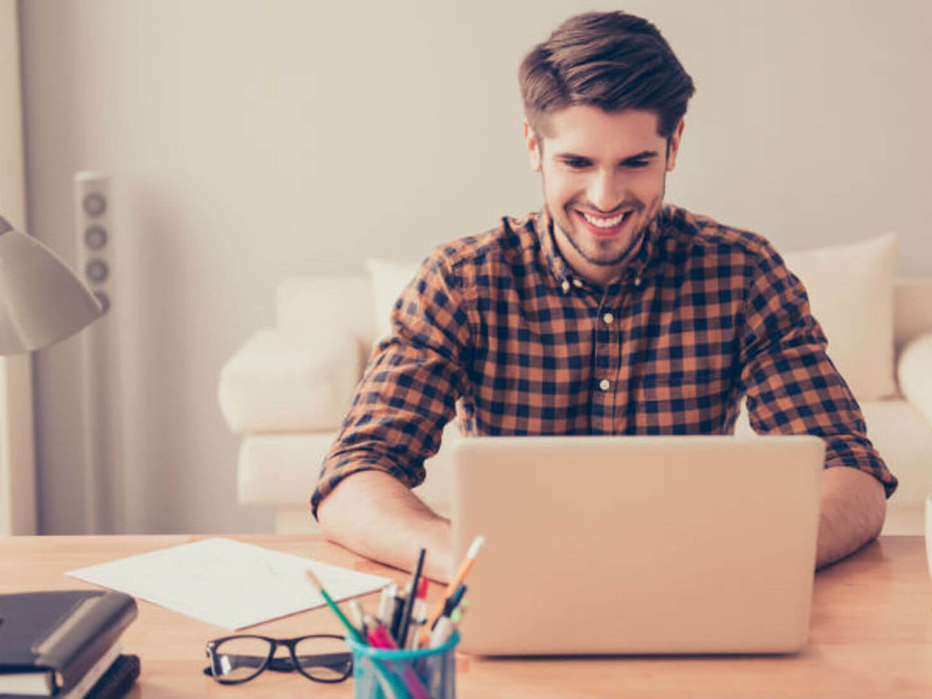 man looks at something on the computer